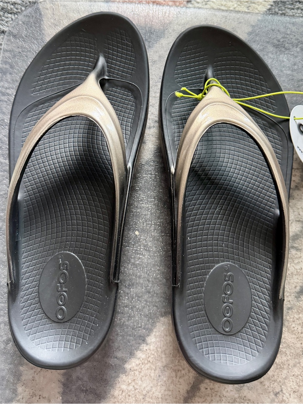 OOFOS Women's Black Flip Flop Sandals with Bronze Straps
